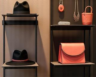 Urban fashion accessories including hats, bags, and jewelry displayed stylishly